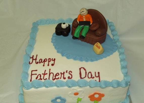 Father_s-day-cake-with-cake-topper-with-father-on-the-coach-with-a-book-on-his-laps_resize2