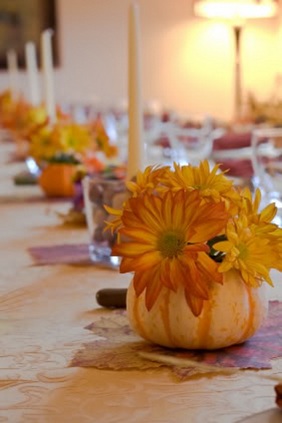 Table decorated for a large thanksgiving gathering.