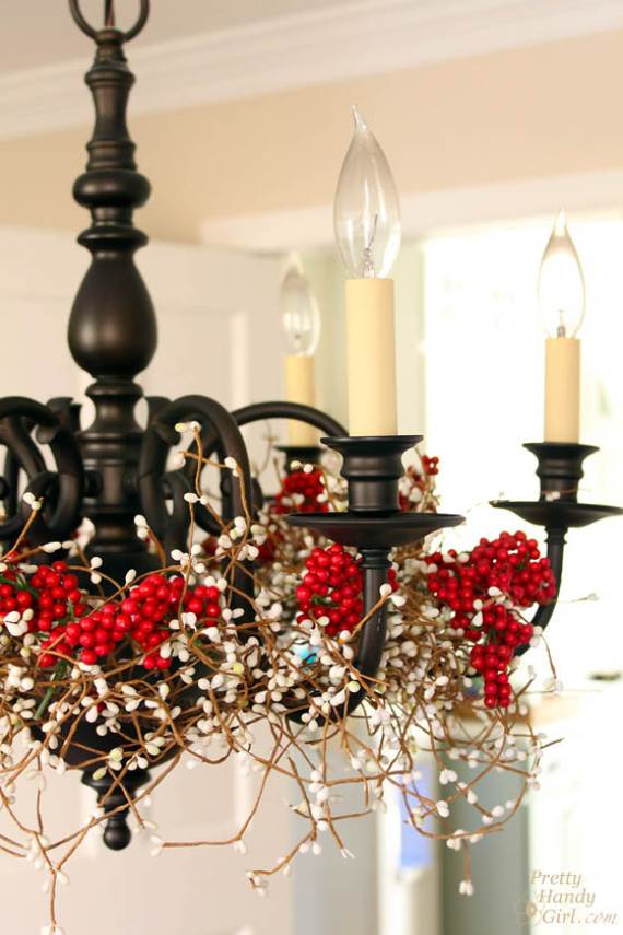 christmas chandeliers lights decorating holidays pendant chandelier decorate decor dining decoration decorated around xmas holiday wrap decorations garland berries fixtures