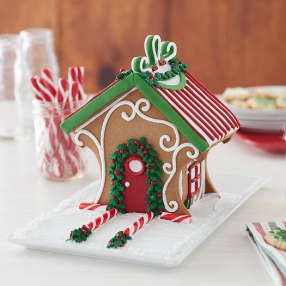 decorating a gingerbread house 