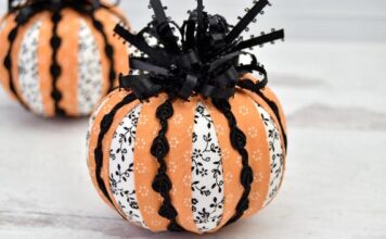 30 Creative Ways to Decorate a Pumpkin with Ribbon Fabric pumpkins adorned with striped orange and floral white ribbons, accented by black lace. They convey a festive and decorative autumn vibe.