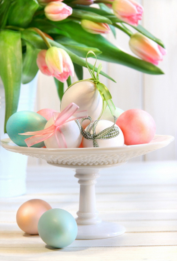 Colored eggs with bows and tulips