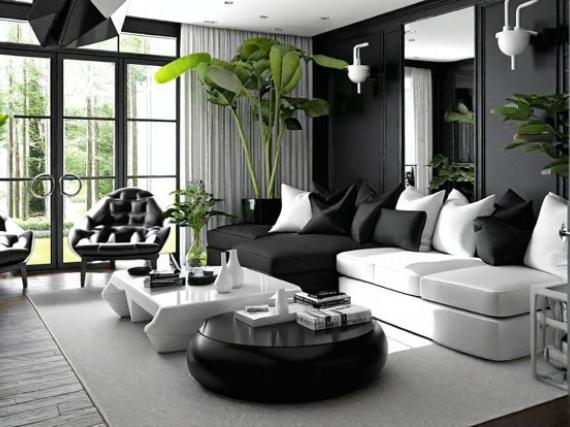 Modern black and white living room with sectional sofa and large windows.