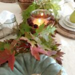 fall-table-decor-with-heirloom-pumpkins-fall-leaves-candle-lanterns-with-pinecones-is-very-cozy