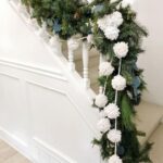 White-pom-pom-stair-garland-for-Christmas-via-@mildlyminimal