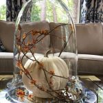 03-a-cloche-with-a-single-white-pumpkin-and-orange-blooms-on-branches-is-a-classic-fall-idea (1)