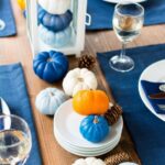 a-modern-Thanksgiving-tablescape-with-bold-blue-placemats-and-light-and-bold-blue-pumpkins-is-a-chic-idea