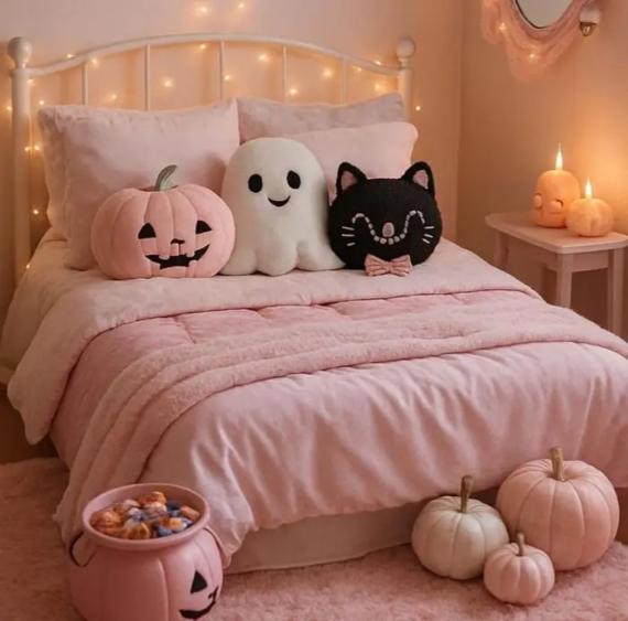 A pink bedroom featuring a pink bed with pillows and a small pumpkin on the floor, creating a cozy atmosphere.