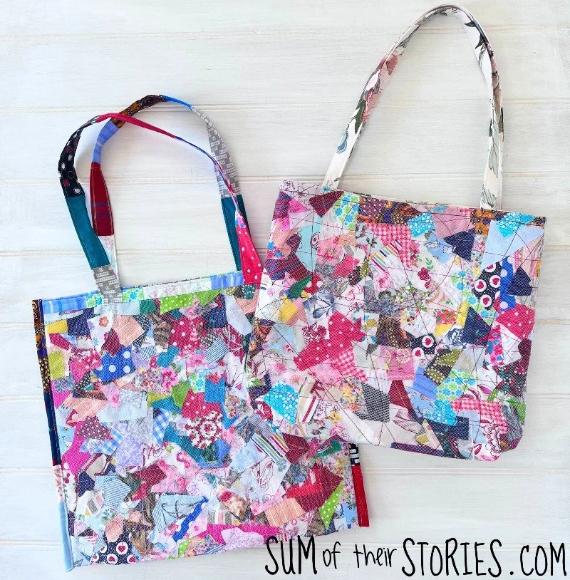 Two colorful patchwork tote bags displayed on a light wooden surface. Each bag features vibrant, assorted fabric scraps in a quilted design, conveying a playful and creative tone.