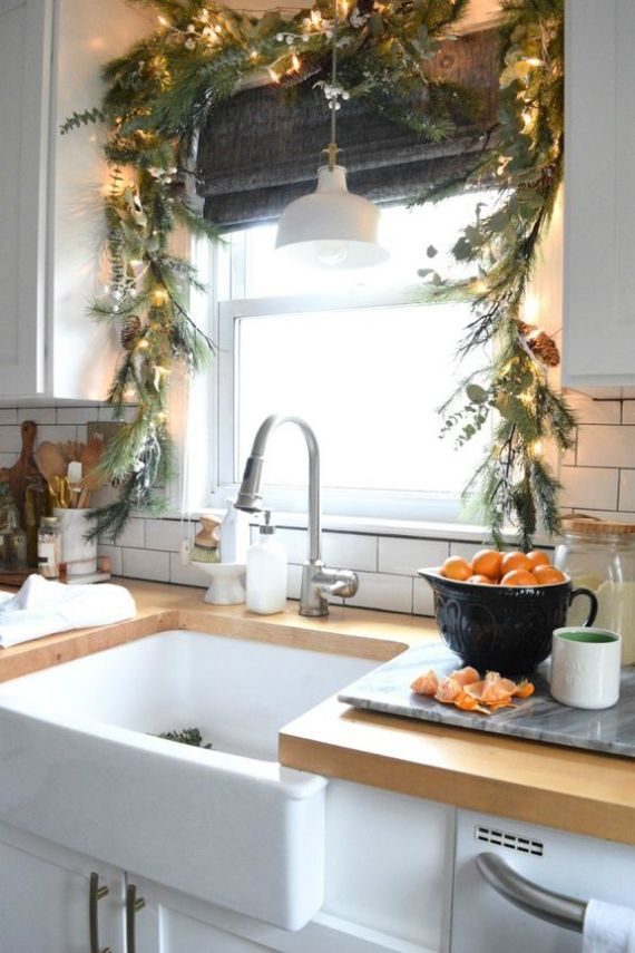 evergreens-and-greenery-Christmas-garland-with-pinecones-and-lights-for-decorating-the-kitchen