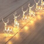 Christmas reindeer in garlands with lights