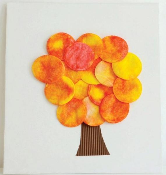 Autumn Tree Cotton Pad Applique made from layered orange and yellow circle shapes cotton pads as leaves on a white background, with a textured brown paper trunk.