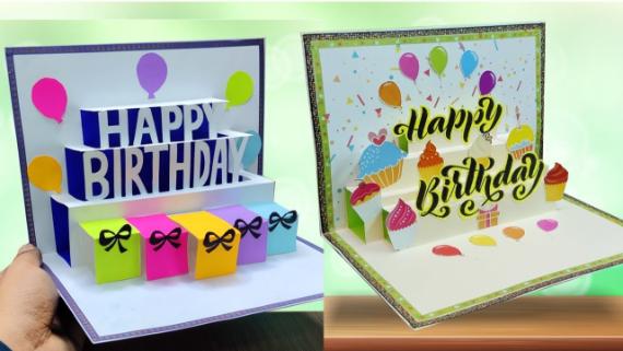 Two vibrant pop-up birthday cards. The left card features "HAPPY BIRTHDAY" with colorful gift boxes, balloons, and ribbons. The right card has cupcakes, balloons, and "Happy Birthday" in bold letters, set in a festive, colorful design.