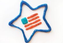 30 Easy Patriotic Crafts For Kids A blue glittery star shape made from artistic material encloses four orange glittery lines and a small teal square, creating a playful, crafty design.