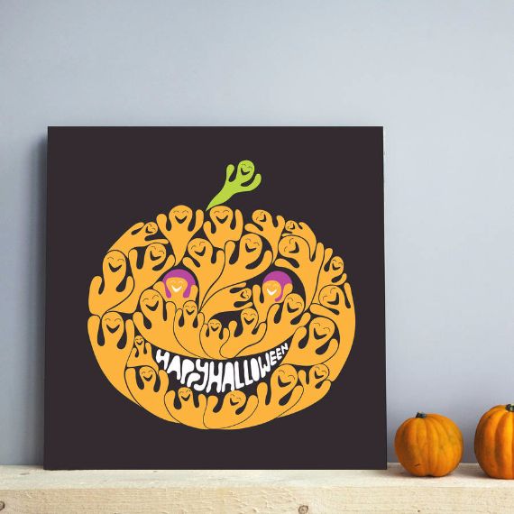 A Halloween-themed artwork features a stylized pumpkin made of small, ghost-like figures with smiling faces. "Happy Halloween" is written as its crooked grin.
